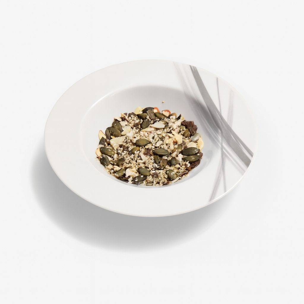 Close-up of UELAV8 Wholefood Medley showing natural mix of hemp, pumpkin, almond and flaxseed flakes.