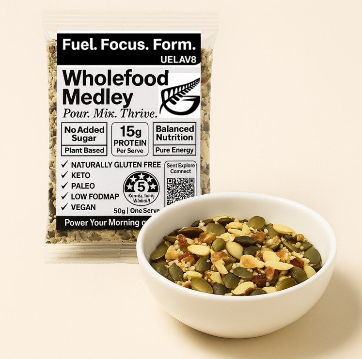 UELAV8 Wholefood Medley sachet with a bowl of mixed nuts and seeds – high protein, low carb, NZ-made vegan blend.